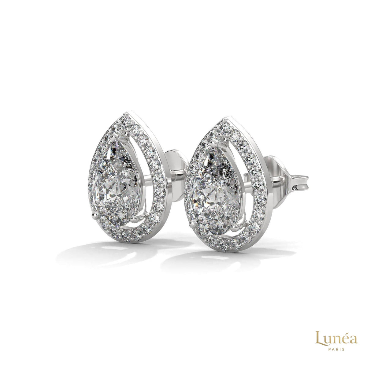 1.09 CT pear-shaped lab-grown diamond halo stud earrings set in polished 14K gold with sparkling pavé accents.