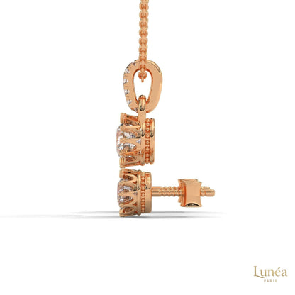 Rose gold crown diamond pendant and earring set with round brilliant lab-grown diamonds in a regal setting.
