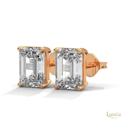 1 carat emerald-cut lab-grown diamond stud earrings set in polished 14K white gold.