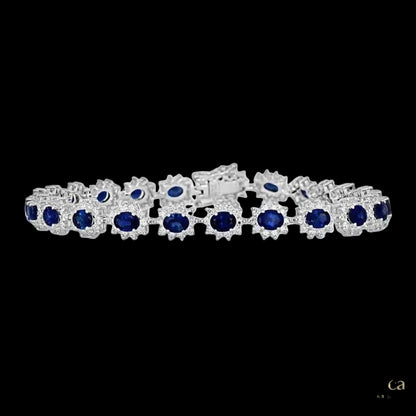 Gold bracelet with blue gemstones on a white background, branded 'Lunea'.