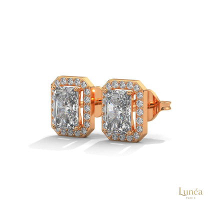 Emerald-cut lab-grown diamond halo stud earrings in 14K gold with a pavé diamond border.