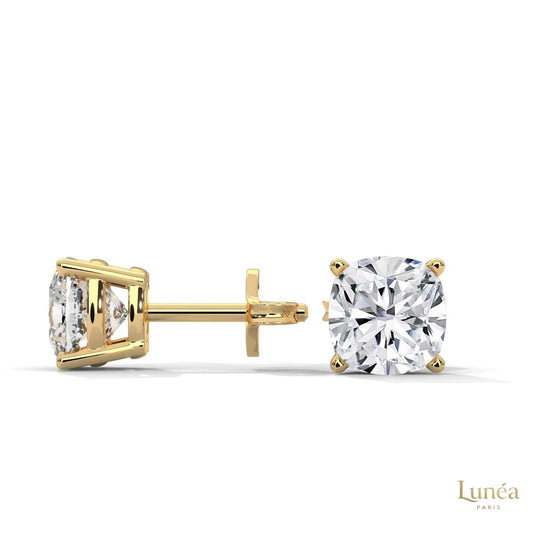 1.25 CT cushion-cut lab-grown diamond stud earrings set in polished 14K gold for a brilliant, timeless look.