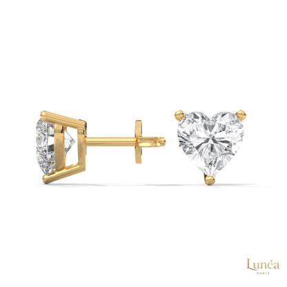 1.25 carat heart-shaped lab-grown diamond stud earrings set in polished 14K yellow gold with a secure three-prong setting.