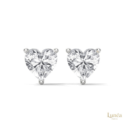 1.25 CT heart-shaped lab-grown diamond stud earrings set in polished 14K white gold with a secure three-prong setting.