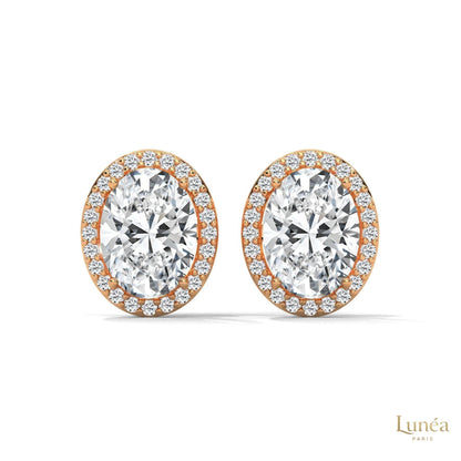 1.25 CT oval halo lab-grown diamond stud earrings set in polished 14K gold with a delicate pavé diamond border.