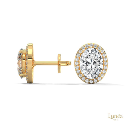 1.25 CT oval lab-grown diamond stud earrings in 14K gold with a sparkling pavé halo setting.