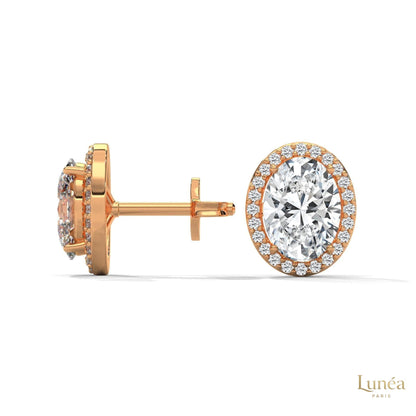 1.25 CT oval lab-grown diamond stud earrings in 14K rose gold with a pavé halo setting.