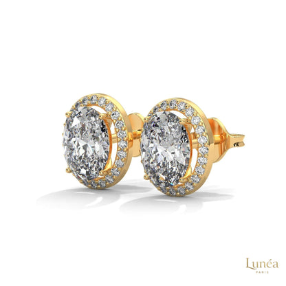 1.25 CT oval lab-grown diamond stud earrings in a pavé halo setting, available in 14K gold or platinum.