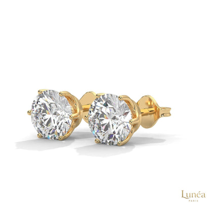 1.30 CT round lab-grown diamond stud earrings in a classic 6-prong setting, crafted in polished 14K white gold.