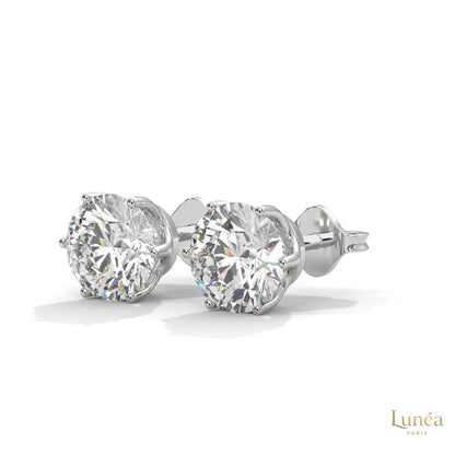 1.30 CT round lab-grown diamond stud earrings in a classic 14K gold six-prong setting.