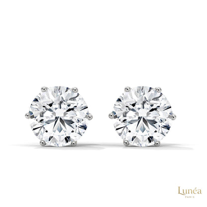 1.30 CT round lab-grown diamond stud earrings in a secure 6-prong setting, crafted in polished 14K white gold.