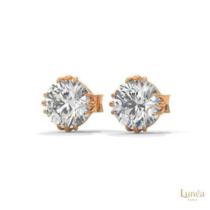 1.30 CT round lab-grown diamond stud earrings in a floral crown setting, crafted in polished 14K white gold.