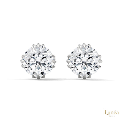 1.30 CT round lab-grown diamond stud earrings in a floral crown setting, crafted in polished 14K white gold.