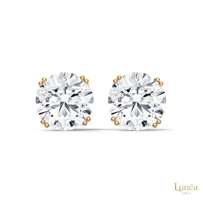 1.30 carat round lab-grown diamond stud earrings set in a classic four-prong 14K white gold mounting.
