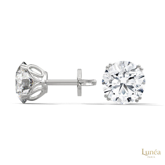1.30 carat round lab-grown diamond stud earrings set in polished 14K white gold with a classic four-prong setting.