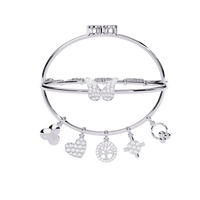 5.7 CTW Diamond Multi-Charm Bangle in White Gold front and detail view 13 – Lunéa Paris