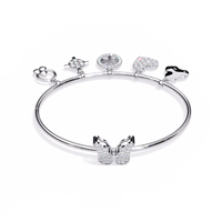 5.7 CTW Diamond Multi-Charm Bangle in White Gold front and detail view 2 – Lunéa Paris