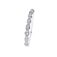 0.8 CTW oval pavé round diamond half-bangle in White Gold, upright angled view – Lunéa Paris