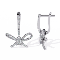 1.2 CTW emerald and round diamond bow hoop drop earrings in White Gold, angled view – Lunéa Paris