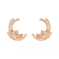 0.2 CTW round diamond sculptural swirl stud earrings in Yellow Gold, angled view – Lunéa Paris