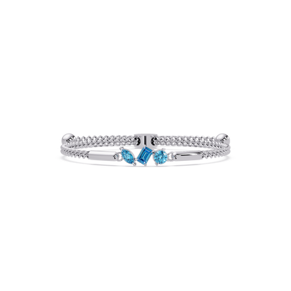 Three-stone mixed-cut colorstone hinged bangle in white gold with aquamarine stones