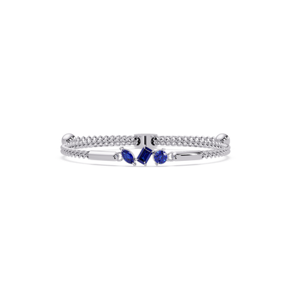 Three-stone mixed-cut colorstone hinged bangle in white gold with sapphire stones
