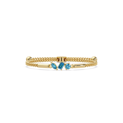 Three-stone mixed-cut colorstone hinged bangle in yellow gold with aquamarine stones