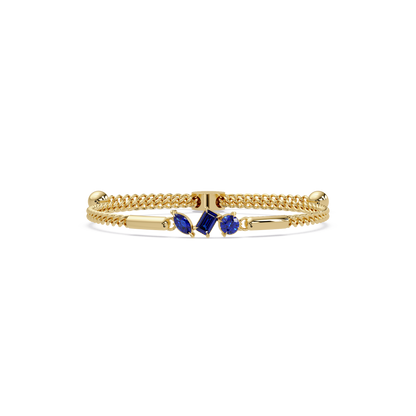 Three-stone mixed-cut colorstone hinged bangle in yellow gold with sapphire stones