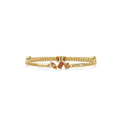 Three-stone mixed-cut colorstone hinged bangle in yellow gold with topaz stones