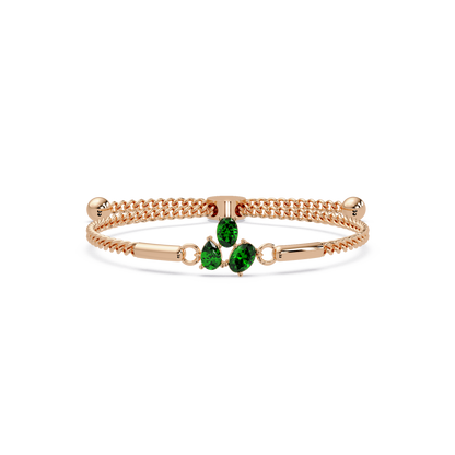 Three-stone pear and oval colorstone hinged bangle in rose gold with green stones
