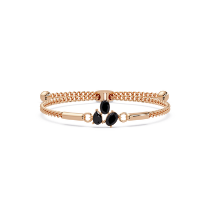 Three-stone pear and oval colorstone hinged bangle in rose gold with onyx stones