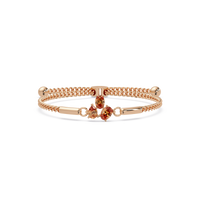 Three-stone pear and oval colorstone hinged bangle in rose gold with topaz stones