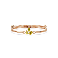 Three-stone pear and oval colorstone hinged bangle in rose gold with yellow stones