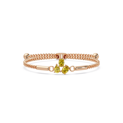 Three-stone pear and oval colorstone hinged bangle in rose gold with yellow stones