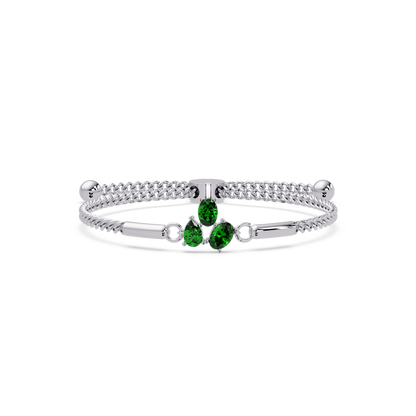 Three-stone pear and oval colorstone hinged bangle in white gold with green stones