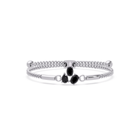 Three-stone pear and oval colorstone hinged bangle in white gold with onyx stones