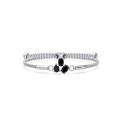 Three-stone pear and oval colorstone hinged bangle in white gold with onyx stones