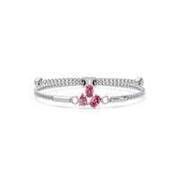 Three-stone pear and oval colorstone hinged bangle in white gold with pink stones