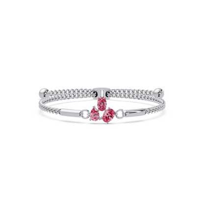 Three-stone pear and oval colorstone hinged bangle in white gold with pink stones