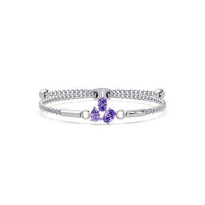 Three-stone pear and oval colorstone hinged bangle in white gold with purple stones
