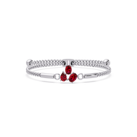 Three-stone pear and oval colorstone hinged bangle in white gold with red stones