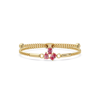 Three-stone pear and oval colorstone hinged bangle in yellow gold with pink stones