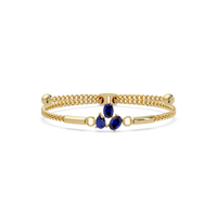 Three-stone pear and oval colorstone hinged bangle in yellow gold with sapphire stones