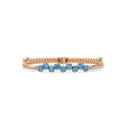 Nine princess-cut aquamarine colorstones in a rose gold chain-accent cuff bracelet