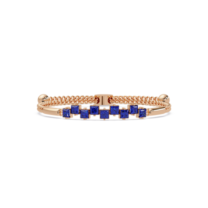 Nine princess-cut sapphire colorstones in a rose gold chain-accent cuff bracelet