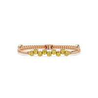 Nine princess-cut yellow colorstones in a rose gold chain-accent cuff bracelet