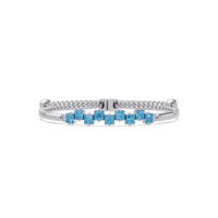 Nine princess-cut aquamarine colorstones in a white gold chain-accent cuff bracelet