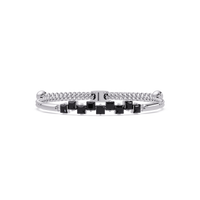 Nine princess-cut onyx colorstones in a white gold chain-accent cuff bracelet