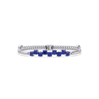 Nine princess-cut sapphire colorstones in a white gold chain-accent cuff bracelet