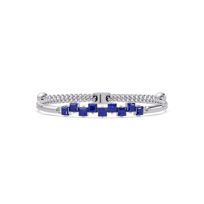 Nine princess-cut sapphire colorstones in a white gold chain-accent cuff bracelet